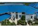 Exterior view of condo featuring a bright blue roof and well-maintained landscaping at 939 Sandpiper Cir, Bradenton, FL 34209