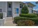 Well-manicured condo exterior with a blue front door, showcasing a welcoming entrance at 939 Sandpiper Cir, Bradenton, FL 34209