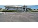 Community building with parking in front of the well-maintained gray building at 939 Sandpiper Cir, Bradenton, FL 34209