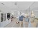 Bright living room with plush seating, white furnishings, and open floor plan with entry way at 939 Sandpiper Cir, Bradenton, FL 34209
