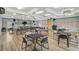 Well-lit meeting room offering neutral tones, tables and chairs at 939 Sandpiper Cir, Bradenton, FL 34209