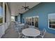Inviting outdoor screened porch featuring seating and views at 939 Sandpiper Cir, Bradenton, FL 34209