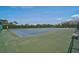 Community tennis courts surrounded by lush greenery, perfect for recreational play and exercise at 939 Sandpiper Cir, Bradenton, FL 34209