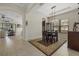 Elegant dining room with tray ceiling, designer lighting, and easy access to the living area at 9769 Highland Park Pl, Palmetto, FL 34221
