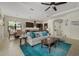 Open concept living space with kitchen, dining, and living areas in a bright and airy home at 9769 Highland Park Pl, Palmetto, FL 34221
