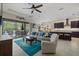 Open concept living space with kitchen, dining, and living areas overlooking the lanai at 9769 Highland Park Pl, Palmetto, FL 34221