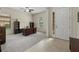 Spacious home office featuring ample natural light, neutral carpet and tiled entry at 9769 Highland Park Pl, Palmetto, FL 34221