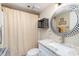Bathroom featuring updated fixtures, modern vanity, and decorative mirror at 104 Capri Isles Blvd # 207, Venice, FL 34292