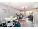 Comfortable living room and dining area with stylish decor and natural light at 104 Capri Isles Blvd # 207, Venice, FL 34292