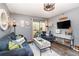 Cozy living room featuring stylish furniture, and a relaxing ambiance at 104 Capri Isles Blvd # 207, Venice, FL 34292