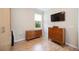 Bedroom with hardwood flooring, a window, and matching wooden dressers at 10523 Old Grove Cir, Bradenton, FL 34212