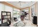 Bright bonus room with sliding glass doors and tile flooring at 10523 Old Grove Cir, Bradenton, FL 34212