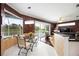 Bright breakfast nook with tile flooring and views of outdoor landscape at 10523 Old Grove Cir, Bradenton, FL 34212