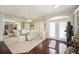 Formal dining room with a glass table, elegant chairs, and ample natural light at 10523 Old Grove Cir, Bradenton, FL 34212