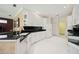 Bright kitchen featuring white cabinets, stainless steel appliances, and elegant granite countertops at 10523 Old Grove Cir, Bradenton, FL 34212
