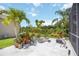 Landscaped patio with potted plants and a view of the lake at 10523 Old Grove Cir, Bradenton, FL 34212
