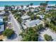 Aerial view highlighting the property's location near the beach and mature trees at 112 Palm Ave, Anna Maria, FL 34216