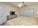 Comfortable bedroom with a ceiling fan, a dresser, and bright, natural lighting at 112 Palm Ave, Anna Maria, FL 34216