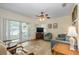 Comfortable living area with natural light, tile floors, and easy access to outdoor spaces at 112 Palm Ave, Anna Maria, FL 34216