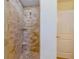 Shower with tiled walls, built-in shelving, and a shower head at 112 Palm Ave, Anna Maria, FL 34216