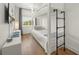 Cozy bedroom featuring a white bunk bed with a sturdy metal ladder and wood flooring at 120 White Ave, Anna Maria, FL 34216