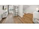 Charming bedroom with bunk beds, wood floors, shiplap accent wall and bright natural light at 120 White Ave, Anna Maria, FL 34216