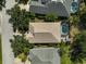 Aerial view of a single-Gathering home with a private pool and mature landscaping in a residential neighborhood at 12149 Forest Park Cir, Bradenton, FL 34211