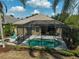 Overhead view of a screened-in pool and patio, with outdoor seating for relaxation and entertaining at 12149 Forest Park Cir, Bradenton, FL 34211