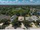 Aerial view featuring a landscaped property with a pond in the neighborhood at 12149 Forest Park Cir, Bradenton, FL 34211