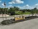 Inviting community entrance sign surrounded by lush landscaping, creating a welcoming atmosphere at 12149 Forest Park Cir, Bradenton, FL 34211