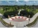 Elegant community entrance with decorative landscaping, creating a sense of arrival at 12149 Forest Park Cir, Bradenton, FL 34211