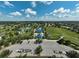 An aerial view of the community park showcases tennis courts and playground at 12149 Forest Park Cir, Bradenton, FL 34211