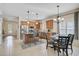 Bright eat-in kitchen with stainless steel appliances, granite island, and adjacent dining area at 12149 Forest Park Cir, Bradenton, FL 34211