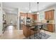 Well-lit kitchen with granite countertops, stainless steel appliances, and a breakfast bar at 12149 Forest Park Cir, Bradenton, FL 34211