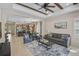 Stylish living room with a ceiling fan, open layout, and seamless transition to the kitchen and dining areas at 12149 Forest Park Cir, Bradenton, FL 34211
