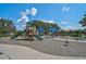 A colorful playground with slides, climbing structures, and swings, offering Gathering-friendly fun at 12149 Forest Park Cir, Bradenton, FL 34211