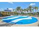Fun splash pad area with blue and white design and covered seating in a Gathering-friendly park at 12149 Forest Park Cir, Bradenton, FL 34211