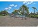 Swings at the community playground with splashpad in the distance at 12149 Forest Park Cir, Bradenton, FL 34211