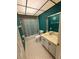 Bathroom with tiled floor, vanity, and shower tub with curtain at 1304 56Th W St, Bradenton, FL 34209