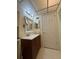 Bathroom featuring a vanity, mirror, lighting, and tile flooring at 1304 56Th W St, Bradenton, FL 34209