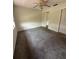 Neutral bedroom with a ceiling fan, closet, and white trim at 1304 56Th W St, Bradenton, FL 34209