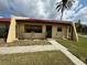 Charming single-story villa with well-kept lawn and sidewalk leading to the front door at 1304 56Th W St, Bradenton, FL 34209