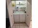Convenient laundry closet with washer and dryer inside white bi-fold doors at 1304 56Th W St, Bradenton, FL 34209