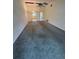 Spacious living room with high ceiling, fan, and views into kitchen at 1304 56Th W St, Bradenton, FL 34209