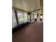 Bright sunroom featuring lots of windows, pleasant outdoor views, and a ceiling fan at 1304 56Th W St, Bradenton, FL 34209