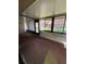 Bright sunroom featuring lots of windows, pleasant outdoor views, and a ceiling fan at 1304 56Th W St, Bradenton, FL 34209