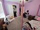 Bedroom with carpeted floors, desk, vanity and chair, decorated with soft lighting at 13156 Merlot Sunstone Cv, Parrish, FL 34219