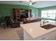 Cozy living room featuring a large entertainment center and comfortable seating at 13156 Merlot Sunstone Cv, Parrish, FL 34219