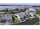 Aerial view of waterfront homes with well-maintained landscaping and lake views in a beautiful community at 1322 Perico Point Cir, Bradenton, FL 34209