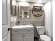 Well-organized bathroom showcasing vanity, decorative tile backsplash, modern fixtures, and a toilet at 1322 Perico Point Cir, Bradenton, FL 34209